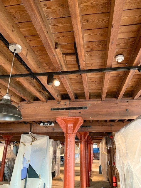 Timber ceiling with clear intumescent coating and exposed steel supports